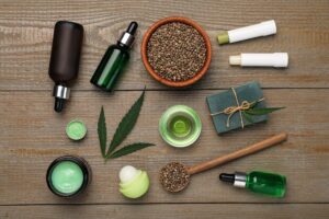 	
A group of green and white objects, possibly representing different types of CBD, displayed on a wood surface.