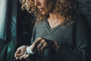 Woman taking a medication - Standard CBD